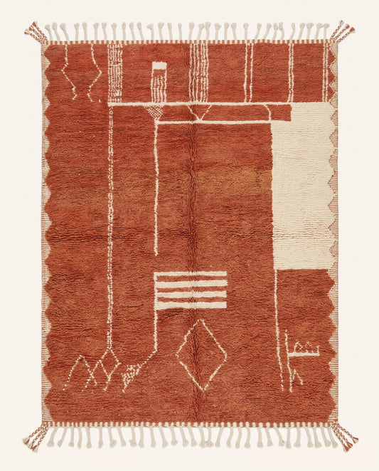 A plush terracotta Boujad Moroccan rug with asymmetrical cream lines and a flatwoven patterned border, crafted by NURA.