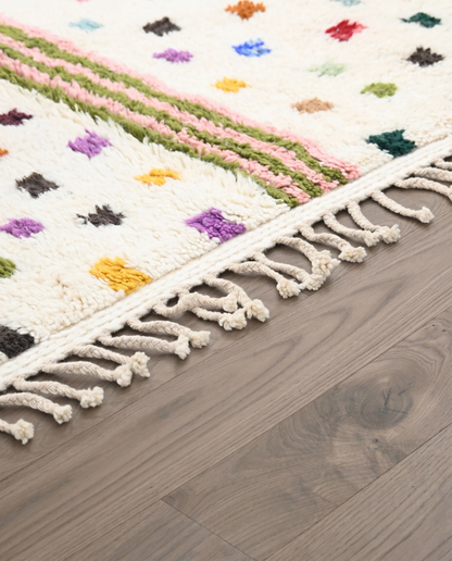 OULA Azilal cream organic abstract Moroccan rug close-up of hand-tied fringe and kilim band detail, by NURA