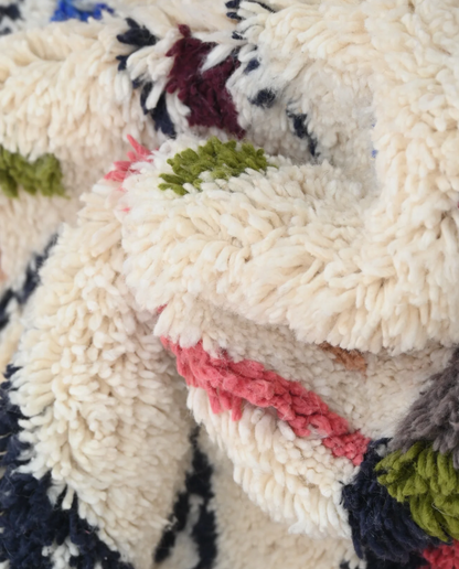 OULA Azilal cream organic abstract Moroccan rug close-up showing hand-knotted wool texture and pile detail 2, by NURA