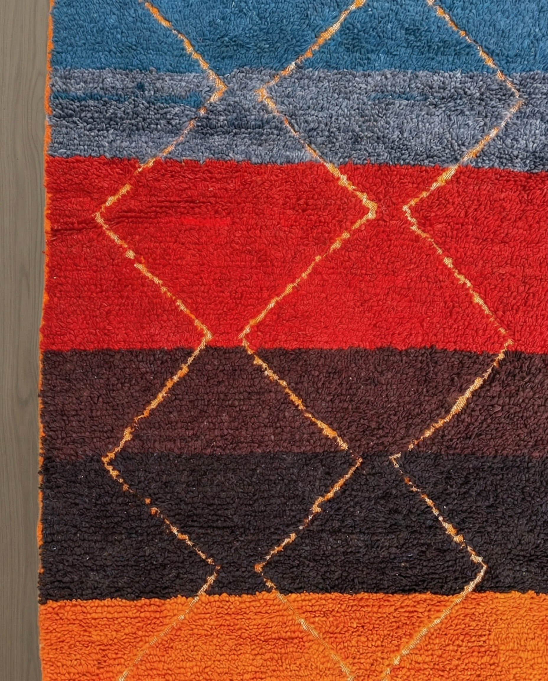 OUMNIA Azilal red banded diamond lattice Moroccan rug close-up showing hand-knotted wool texture and pile detail 1, by NURA