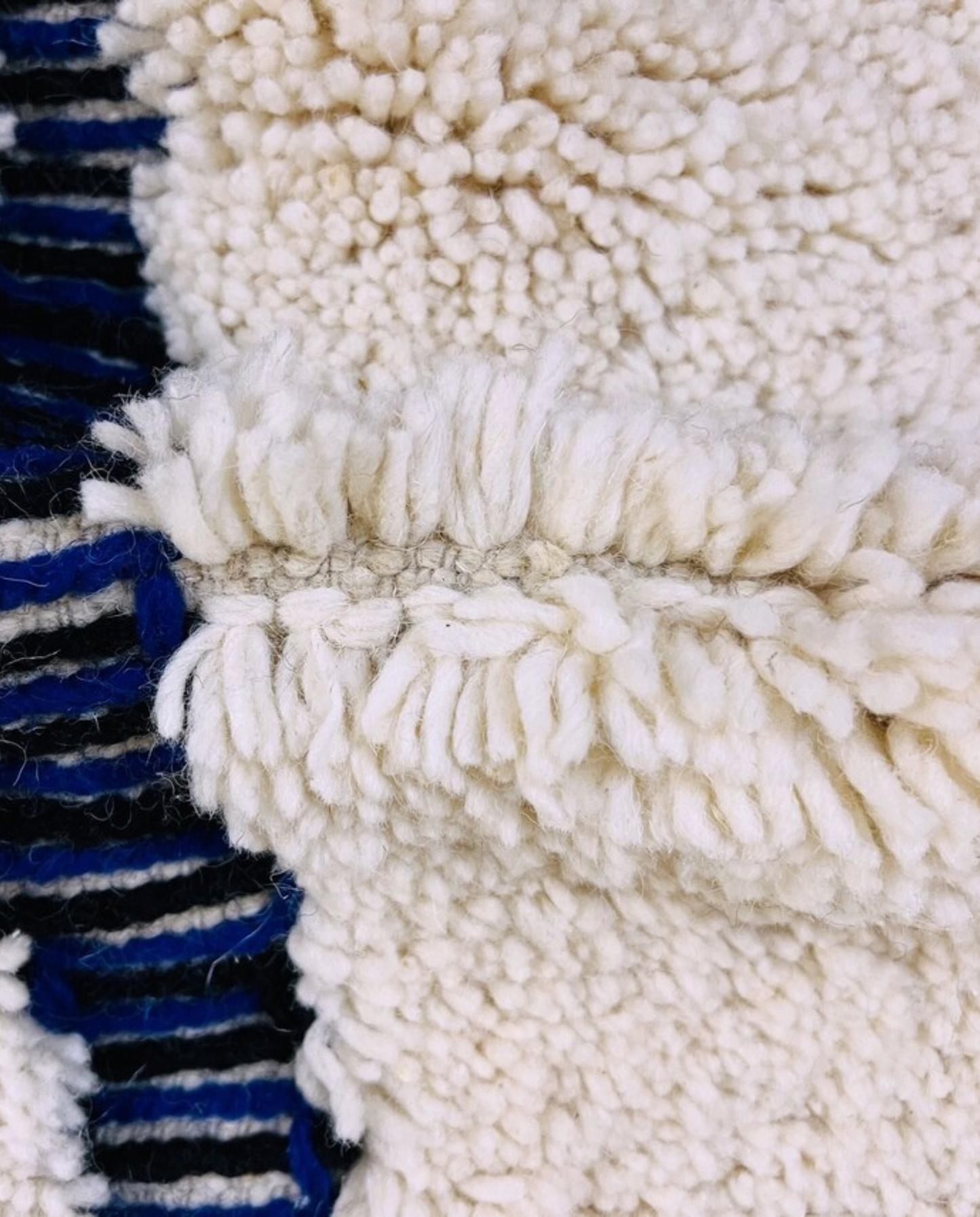 RABAB Beni Ourain cream abstract linear field Moroccan rug close-up showing hand-knotted wool texture and pile detail 3, by NURA