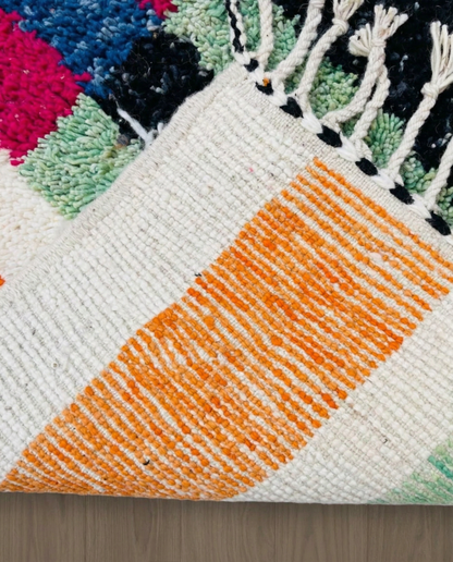 RABIA Beni Ourain ivory abstract striped field Moroccan rug back view showing traditional handwoven construction, by NURA