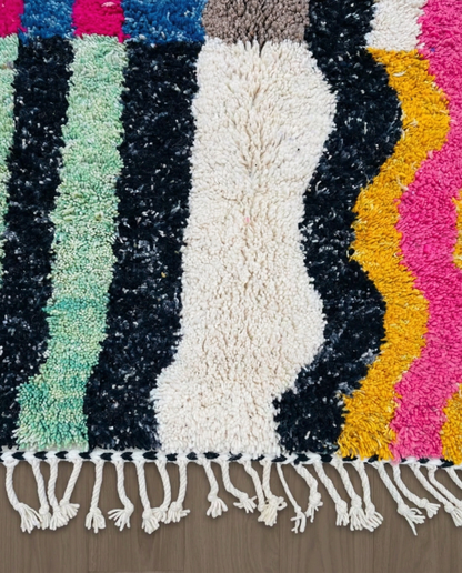 RABIA Beni Ourain ivory abstract striped field Moroccan rug close-up of hand-tied fringe and kilim band detail, by NURA