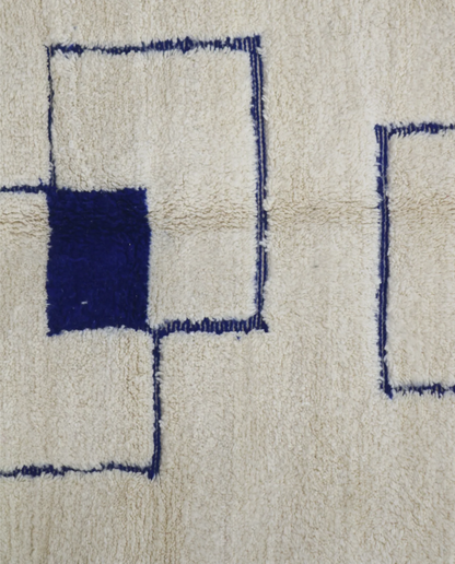 RADNA Azilal cream floating forms Moroccan rug close-up showing hand-knotted wool texture and pile detail, by NURA