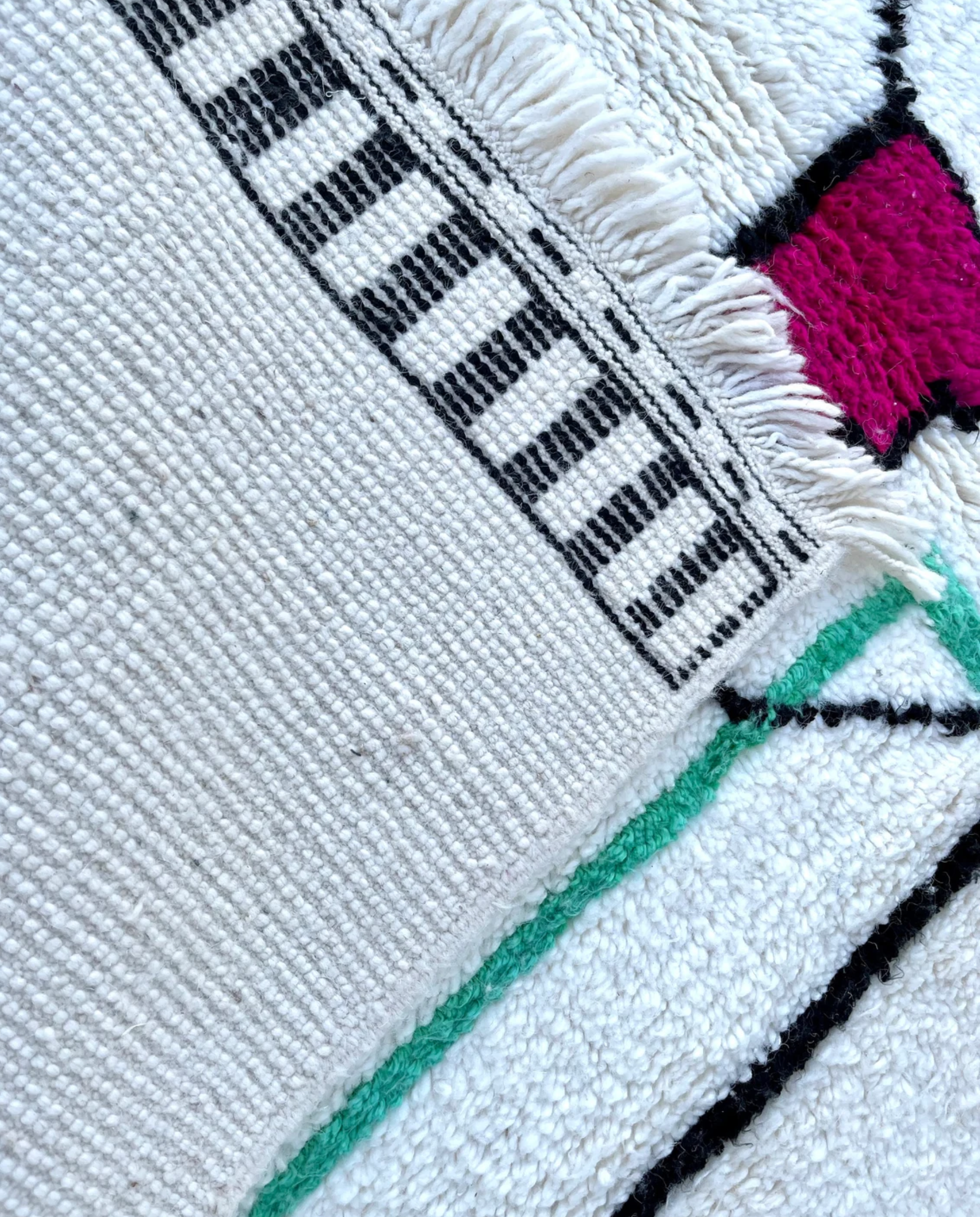 RADWA Azilal ivory scattered abstract motifs Moroccan rug back view showing traditional handwoven construction, by NURA