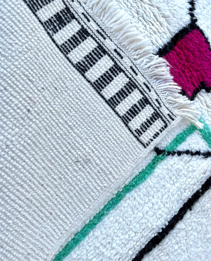 RADWA Azilal ivory scattered abstract motifs Moroccan rug back view showing traditional handwoven construction, by NURA