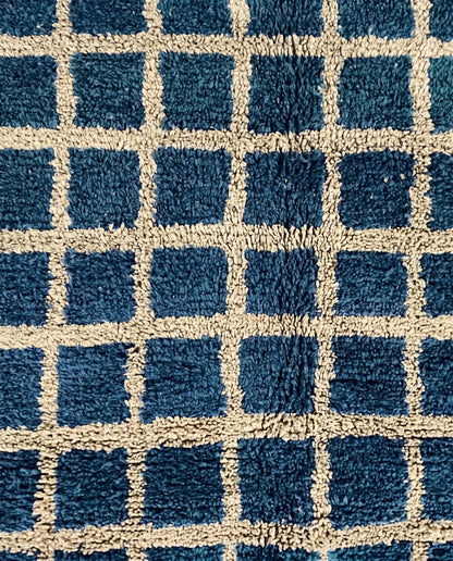 RAMA Beni Ourain navy checker grid Moroccan rug close-up showing hand-knotted wool texture and pile detail 1, by NURA