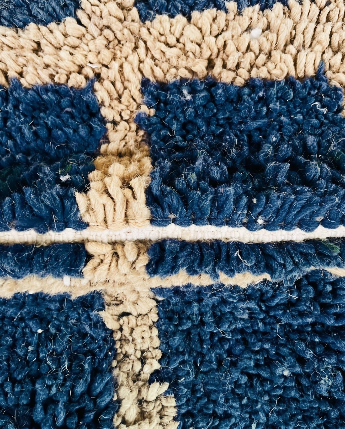 RAMA Beni Ourain navy checker grid Moroccan rug close-up showing hand-knotted wool texture and pile detail 2, by NURA