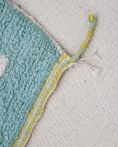 RAMLA Beni Ourain cream abstract bordered field Moroccan rug back view showing traditional handwoven construction, by NURA