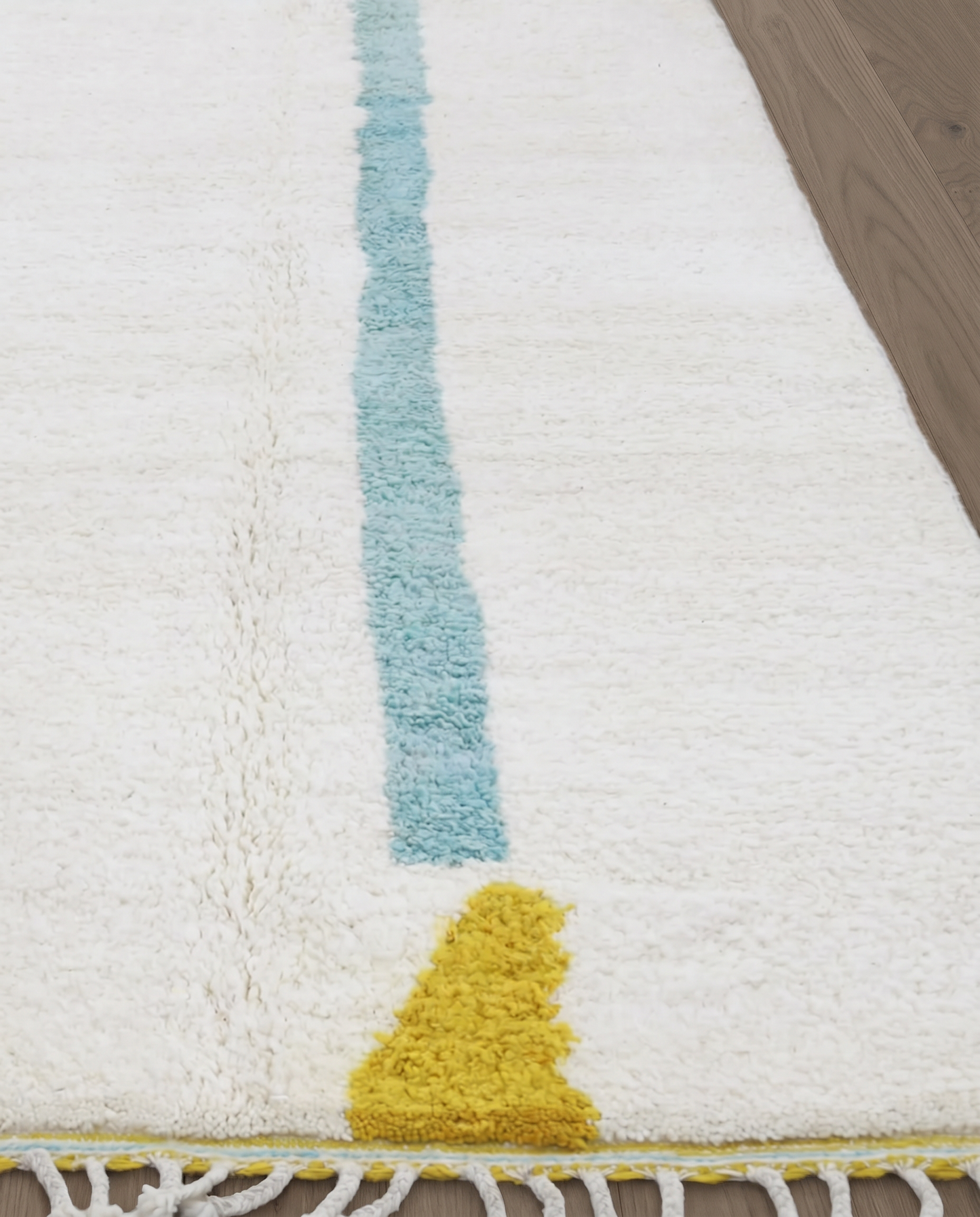 RAMLA Beni Ourain cream abstract bordered field Moroccan rug close-up showing hand-knotted wool texture and pile detail, by NURA