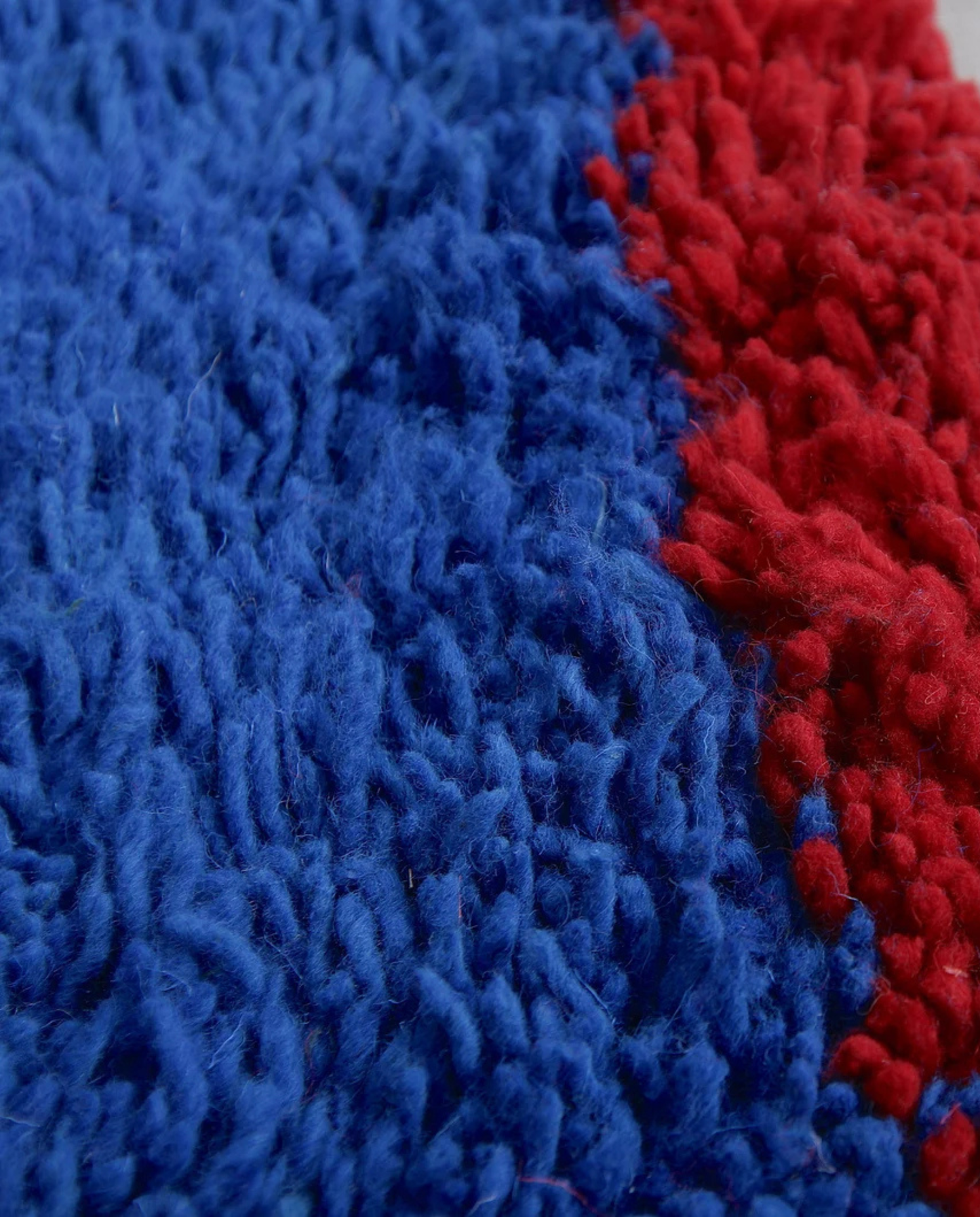 RANIA Beni Ourain cobalt solid border Moroccan rug close-up showing hand-knotted wool texture and pile detail, by NURA