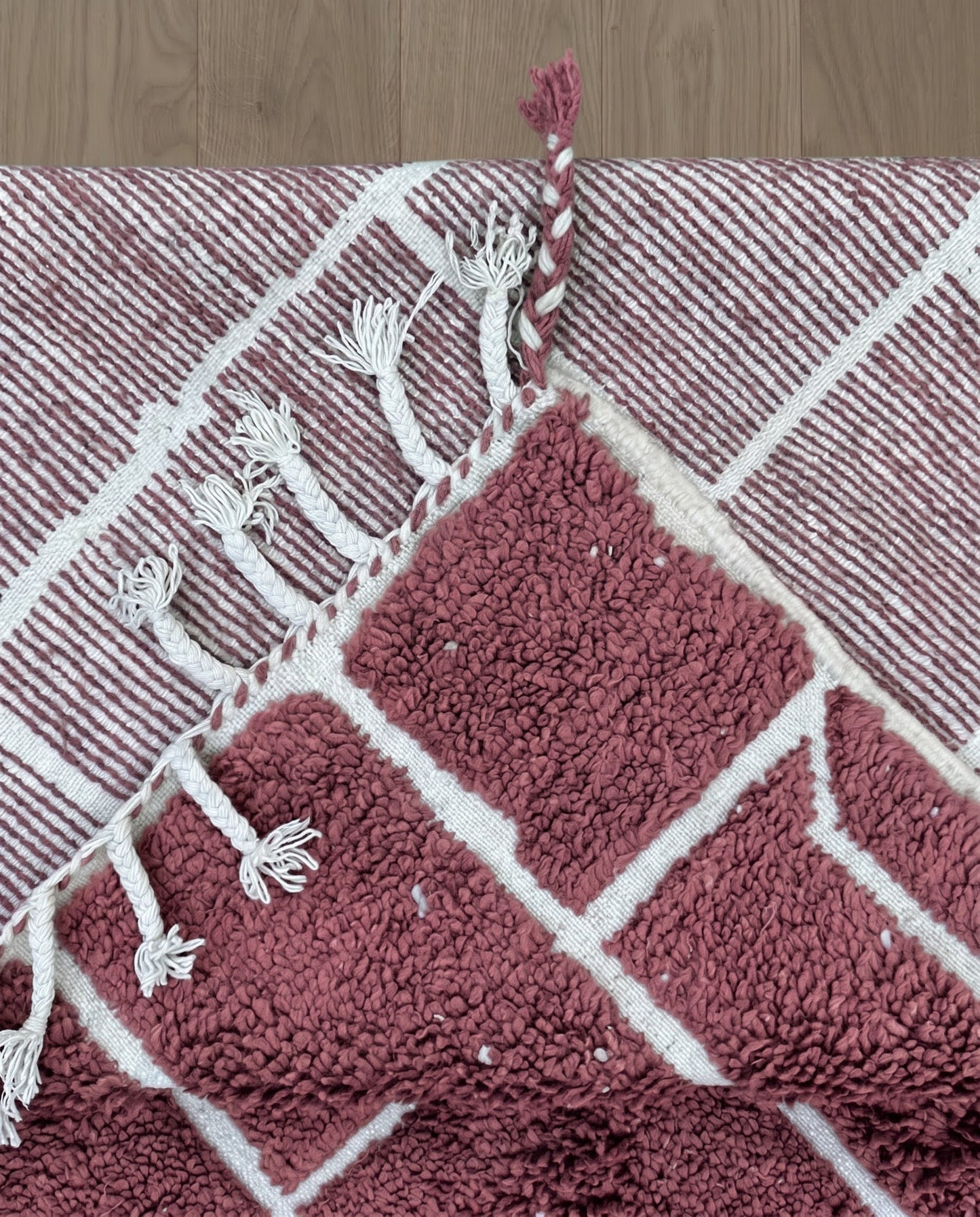 RAZANE Beni Ourain dusty rose irregular block grid Moroccan rug back view showing traditional handwoven construction, by NURA