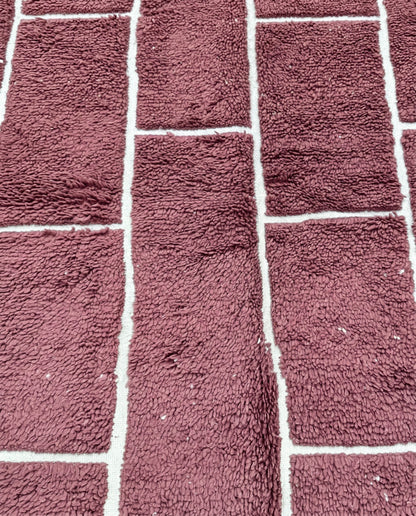 RAZANE Beni Ourain dusty rose irregular block grid Moroccan rug close-up showing hand-knotted wool texture and pile detail, by NURA