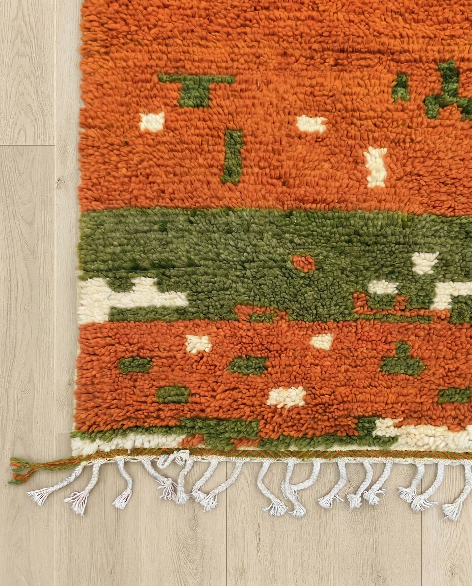 RIHANE Boujad rust organic abstract Moroccan rug close-up of hand-tied fringe and kilim band detail, by NURA