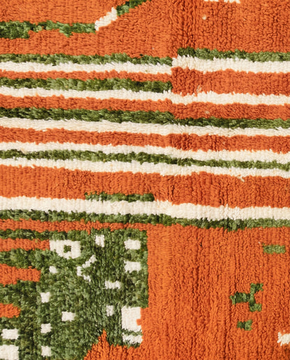 RIHANE Boujad rust organic abstract Moroccan rug close-up showing hand-knotted wool texture and pile detail, by NURA