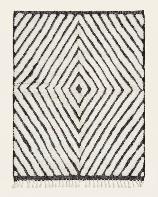 Plush ivory and charcoal Beni Ourain Moroccan rug with a bold concentric diamond pattern and mixed pile texture, by NURA.