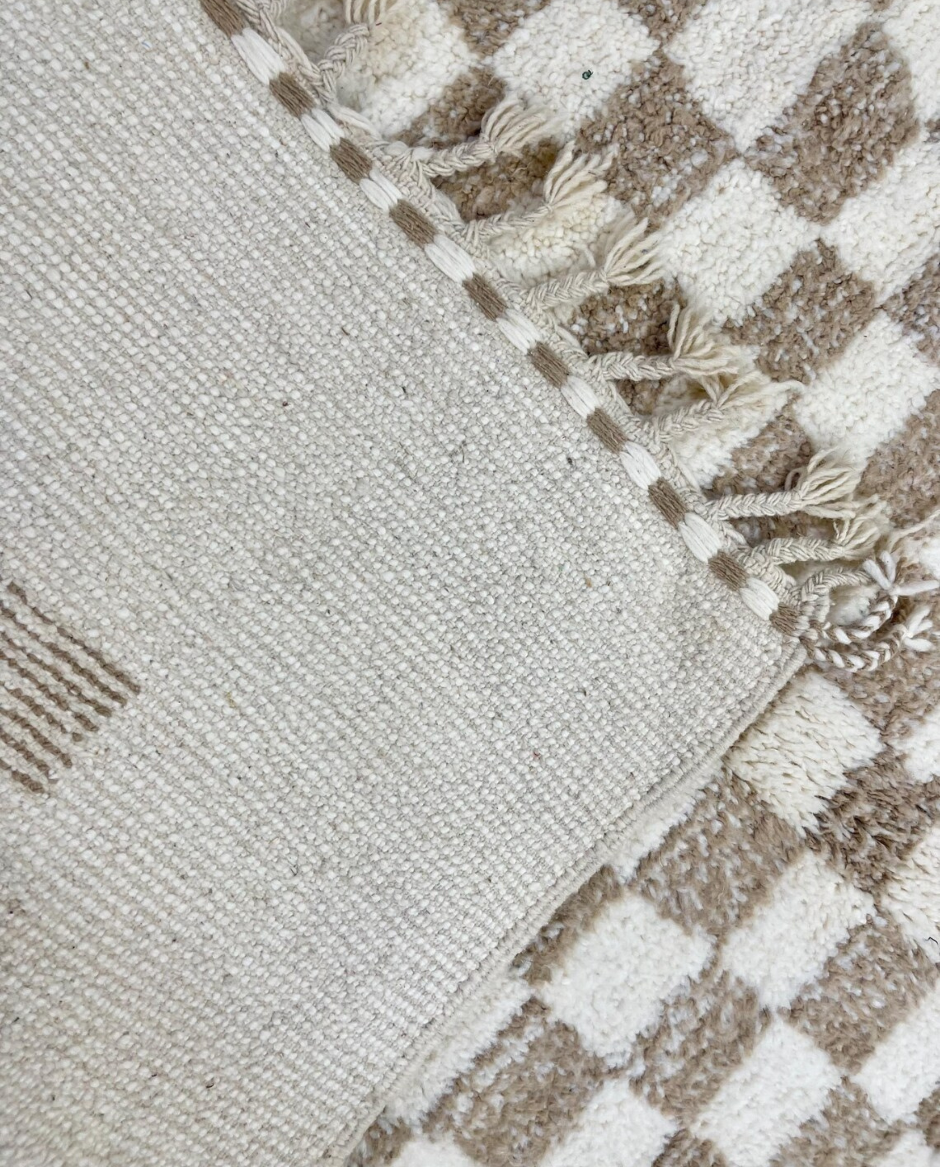 RIMA Beni Ourain cream framed checkerboard Moroccan rug back view showing traditional handwoven construction, by NURA