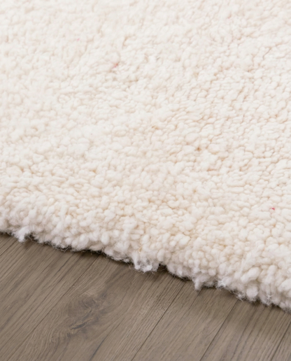 RITA Azilal cream abstract color block Moroccan rug close-up showing hand-knotted wool texture and pile detail 2, by NURA