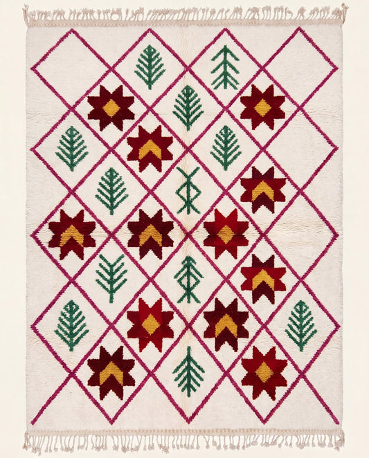 Plush cream Moroccan rug featuring a magenta diamond lattice with alternating red star motifs and green botanical designs by NURA.
