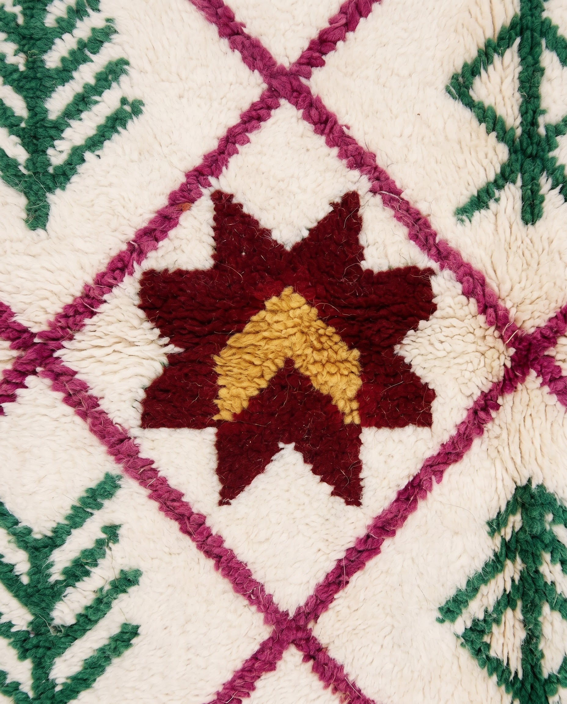 ROUKIA Azilal cream diamond lattice Moroccan rug close-up showing hand-knotted wool texture and pile detail, by NURA