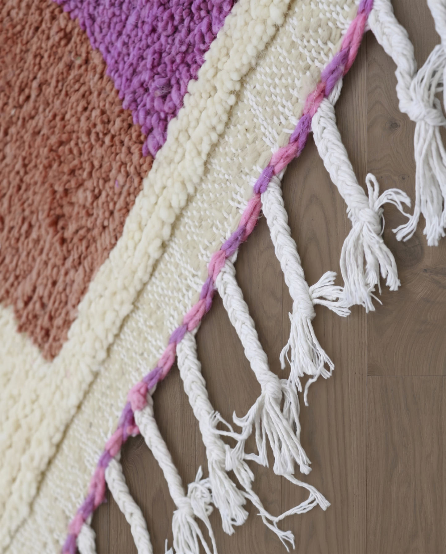 SABA Azilal cream organic abstract Moroccan rug close-up of hand-tied fringe and kilim band detail, by NURA