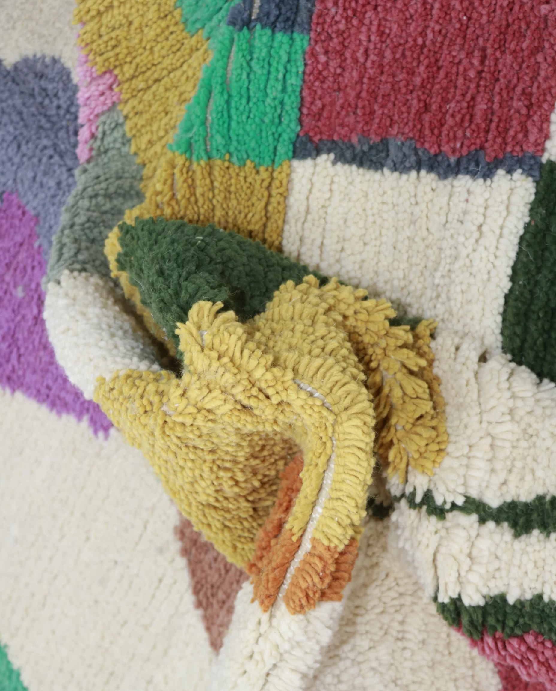 SABA Azilal cream organic abstract Moroccan rug close-up showing hand-knotted wool texture and pile detail, by NURA