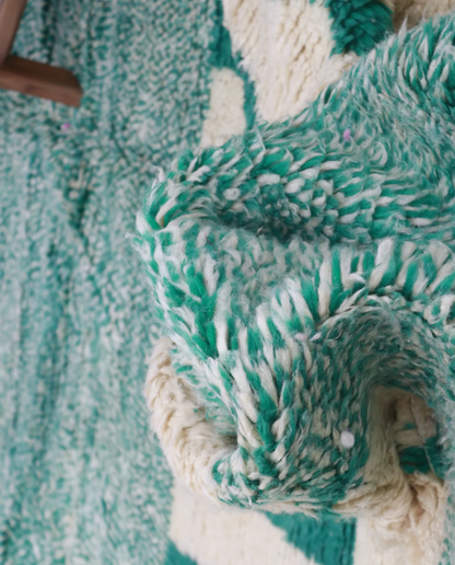 SABIRA Beni Ourain green color block geometric Moroccan rug close-up showing hand-knotted wool texture and pile detail, by NURA