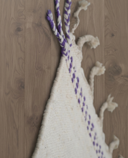 SADIA Azilal cream color block Moroccan rug close-up of hand-tied fringe and kilim band detail, by NURA
