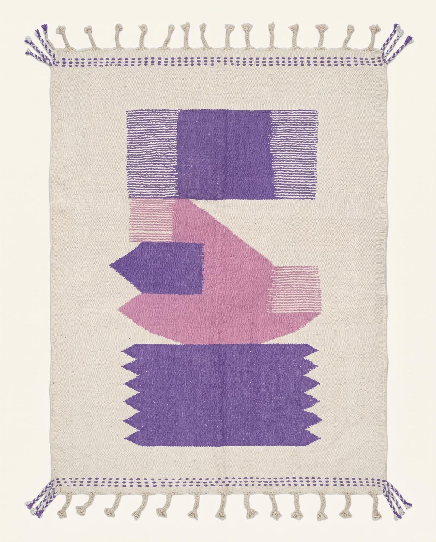 A modern Moroccan flatweave rug featuring bold purple and pink color block shapes on a cream wool background by NURA.