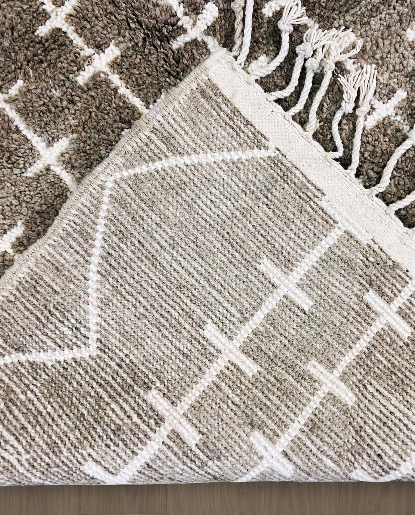 SAFAA Beni Ourain taupe panelled geometric field Moroccan rug back view showing traditional handwoven construction, by NURA
