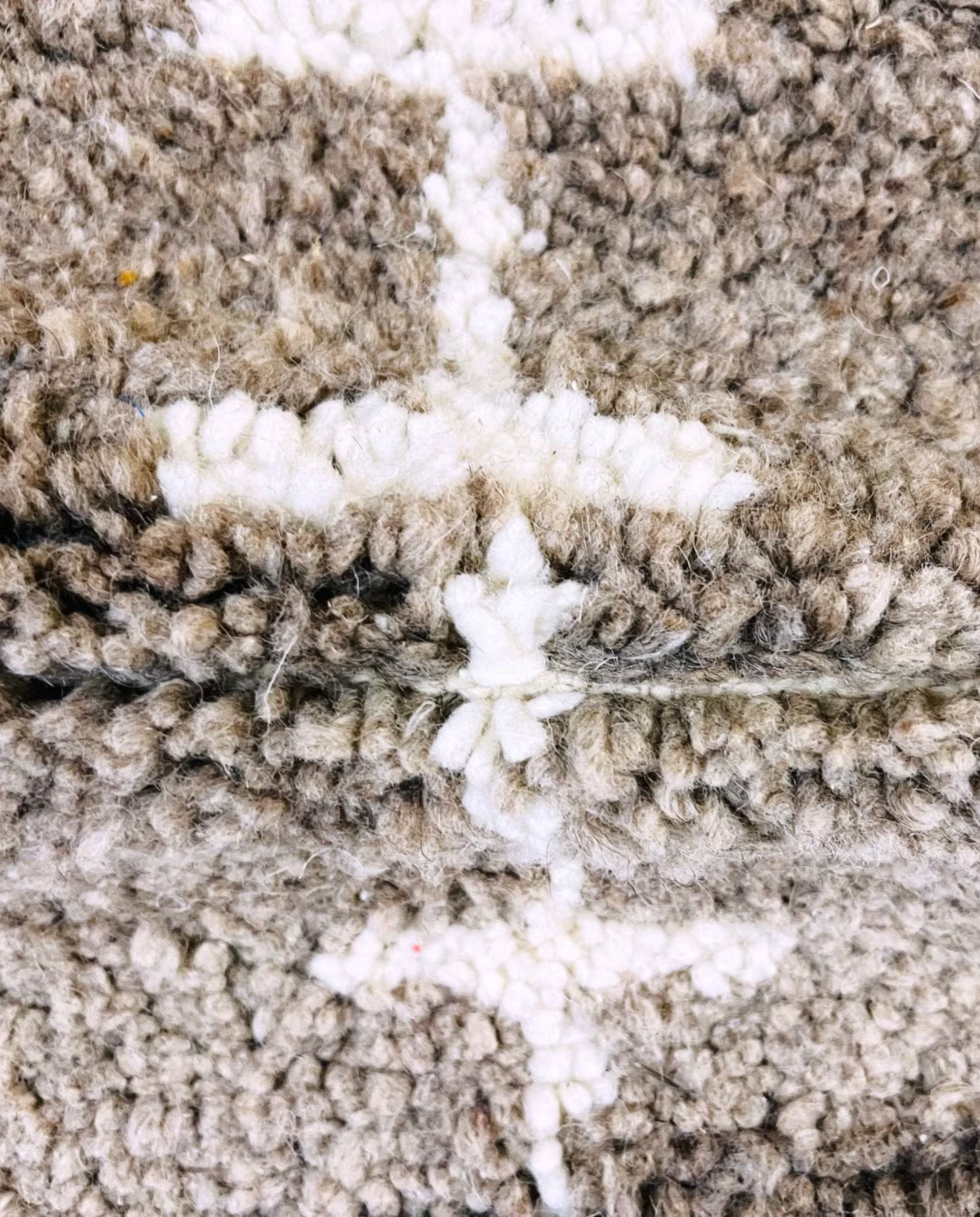 SAFAA Beni Ourain taupe panelled geometric field Moroccan rug close-up showing hand-knotted wool texture and pile detail 1, by NURA