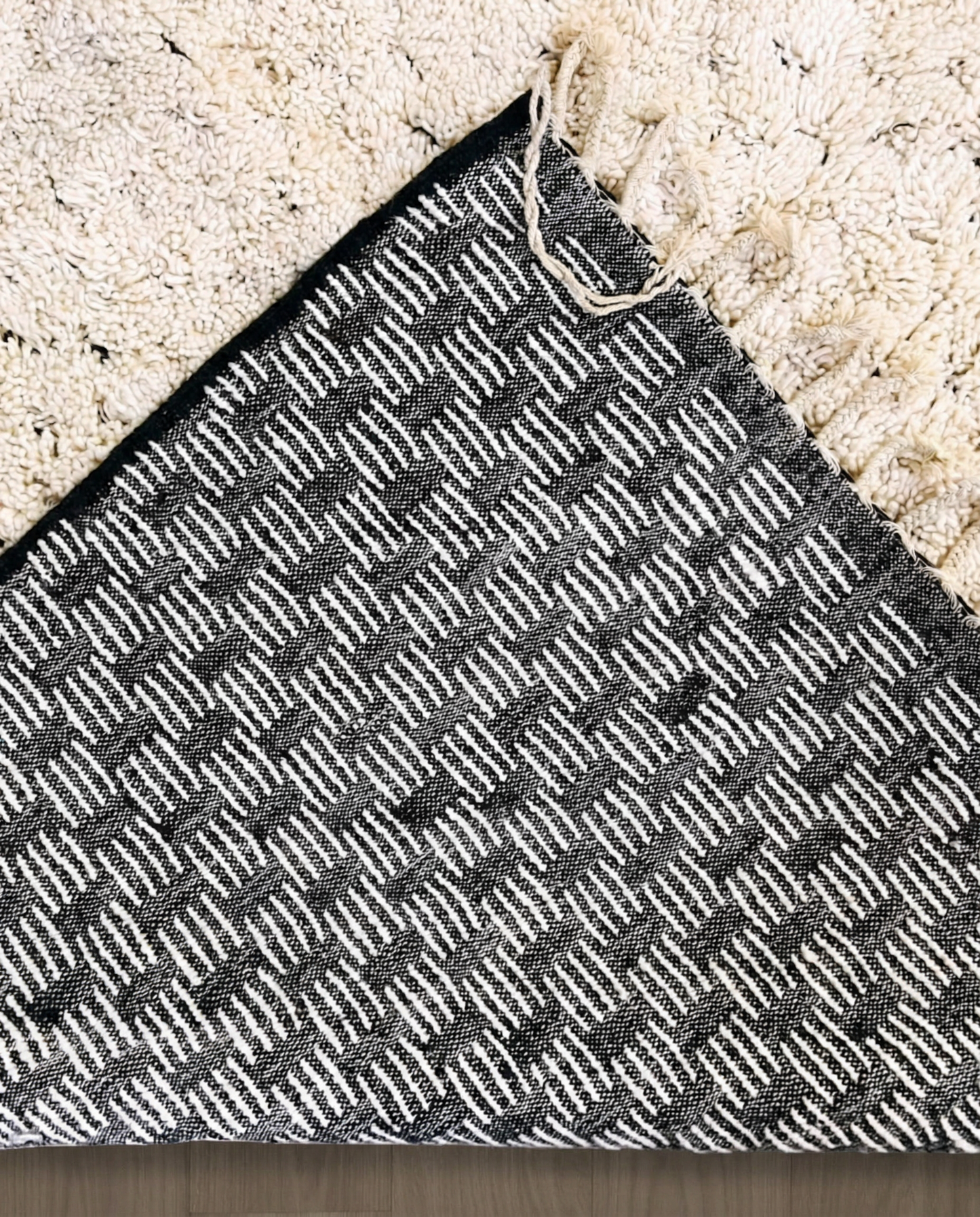 DAMYA Beni Ourain cream dashed line repeat Moroccan rug back view showing traditional handwoven construction, by NURA