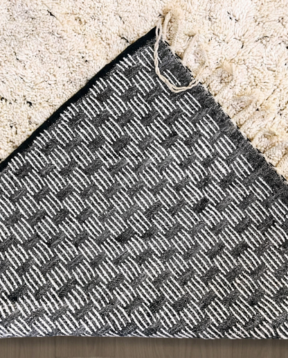 DAMYA Beni Ourain cream dashed line repeat Moroccan rug back view showing traditional handwoven construction, by NURA