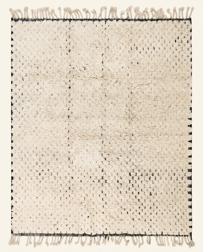 Plush ivory Beni Ourain Moroccan rug with a minimal black dashed line pattern and thick high pile, by NURA.