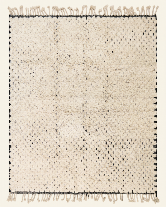 Plush ivory Beni Ourain Moroccan rug with a minimal black dashed line pattern and thick high pile, by NURA.
