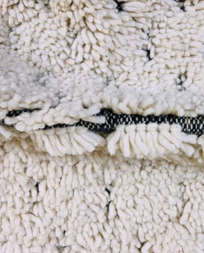 DAMYA Beni Ourain cream dashed line repeat Moroccan rug close-up showing hand-knotted wool texture and pile detail 2, by NURA