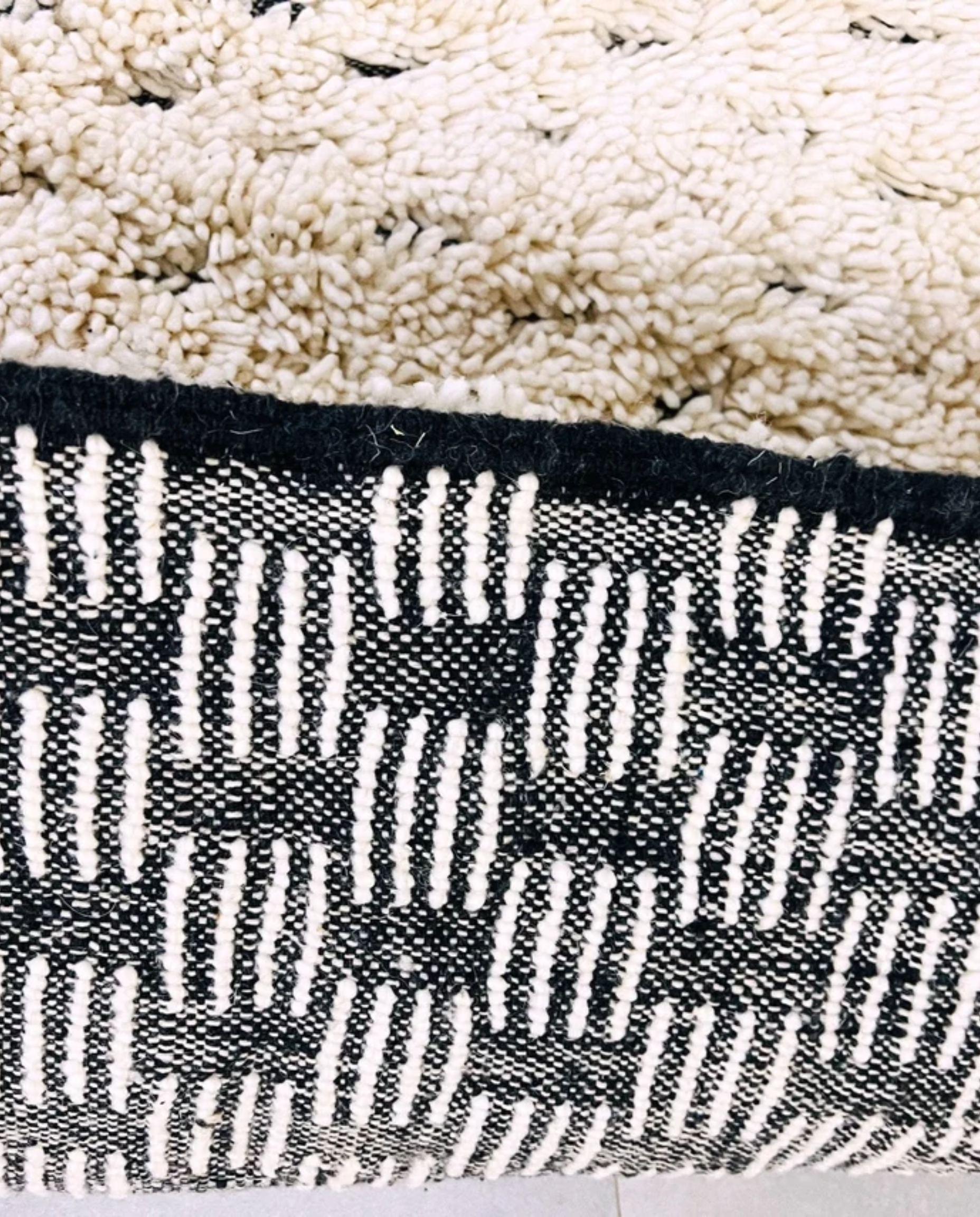 DAMYA Beni Ourain cream dashed line repeat Moroccan rug close-up showing hand-knotted wool texture and pile detail, by NURA
