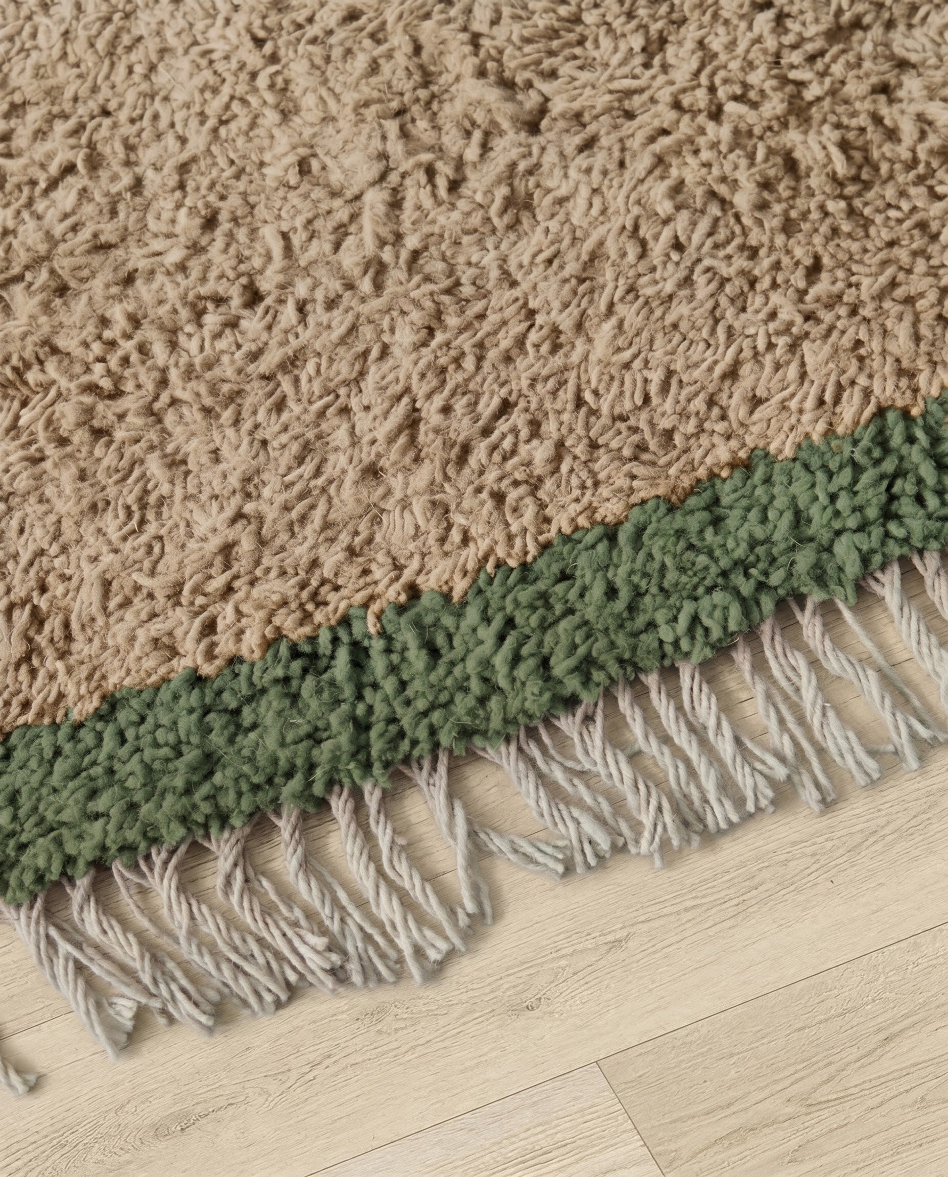SAIDA Beni Ourain beige bordered field Moroccan rug close-up of hand-tied fringe and kilim band detail, by NURA