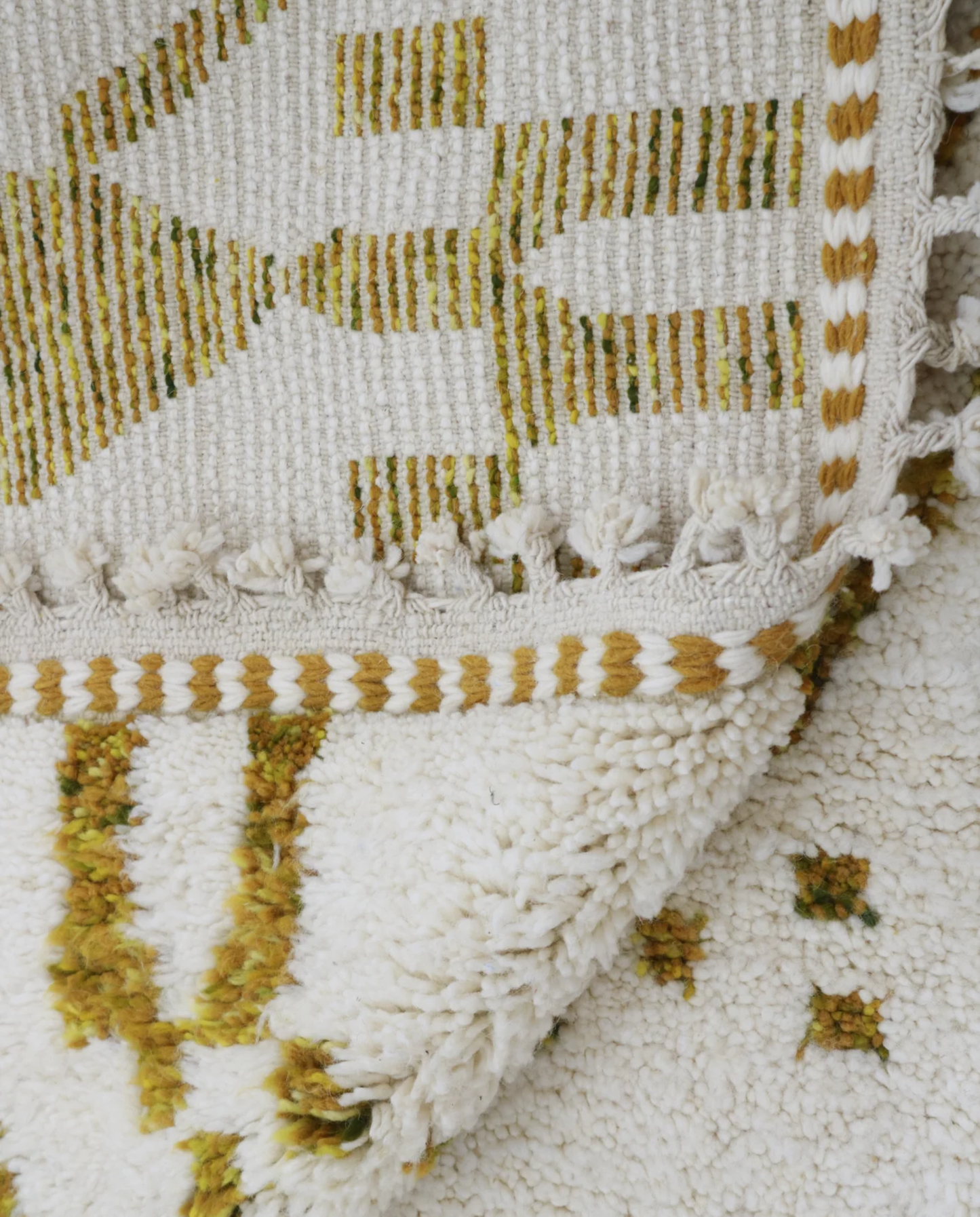 SAJA Beni Ourain cream organic abstract Moroccan rug back view showing traditional handwoven construction, by NURA