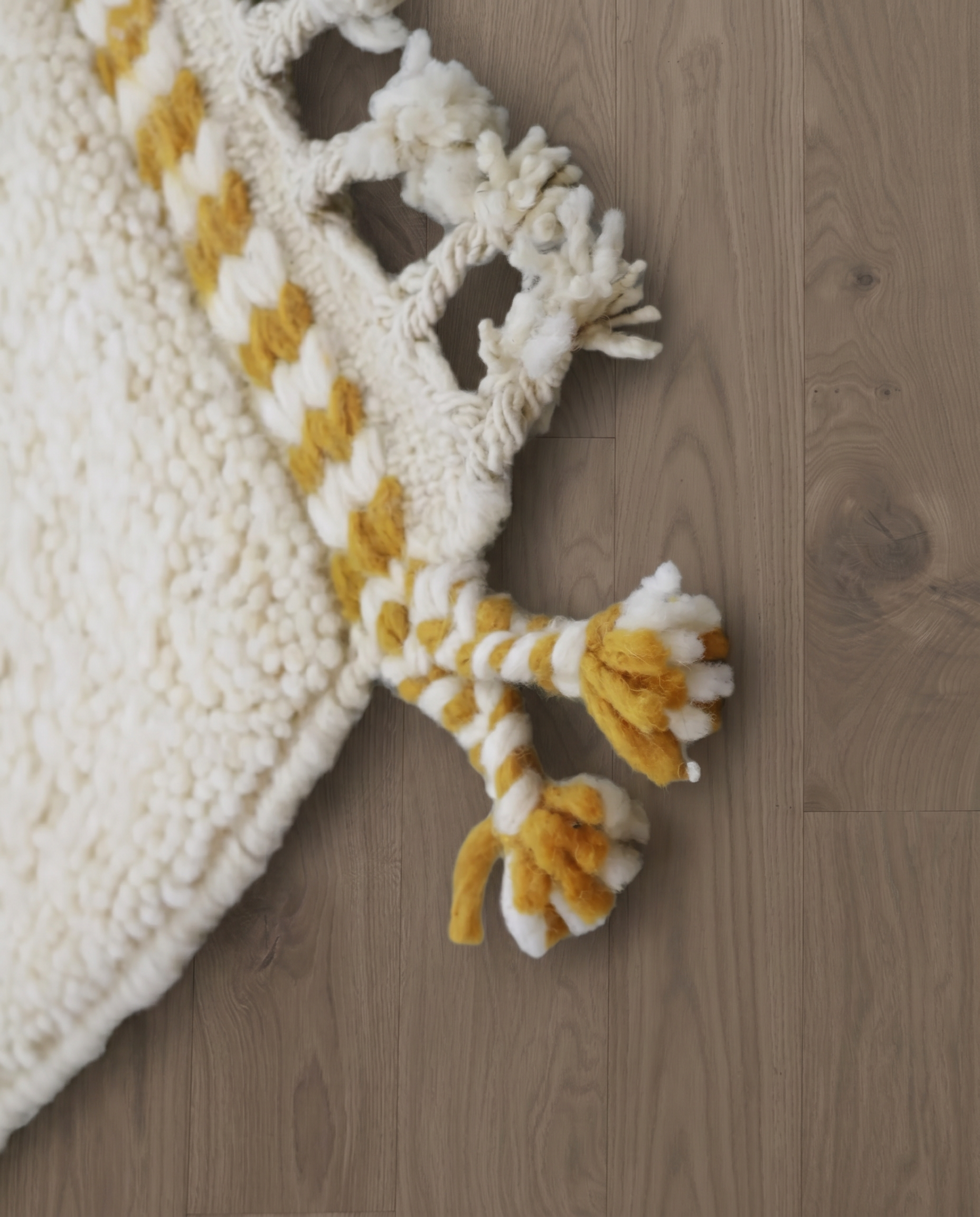 SAJA Beni Ourain cream organic abstract Moroccan rug close-up of hand-tied fringe and kilim band detail, by NURA