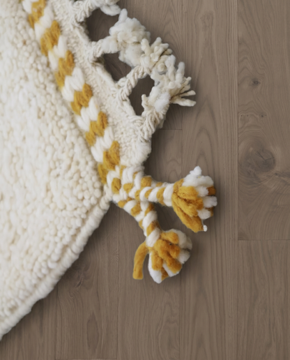SAJA Beni Ourain cream organic abstract Moroccan rug close-up of hand-tied fringe and kilim band detail, by NURA