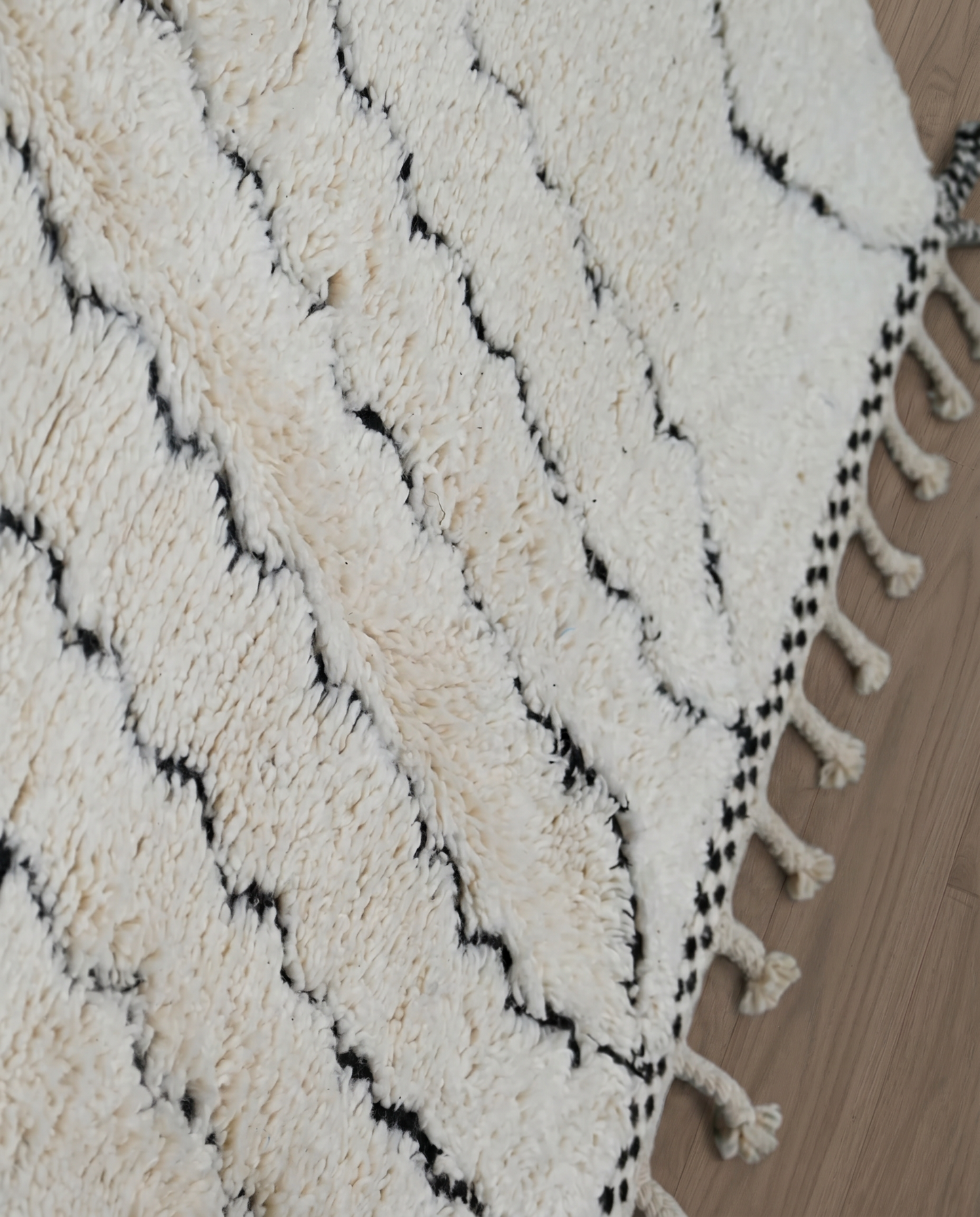SALMA Beni Ourain cream diamond lattice Moroccan rug close-up showing hand-knotted wool texture and pile detail 2, by NURA