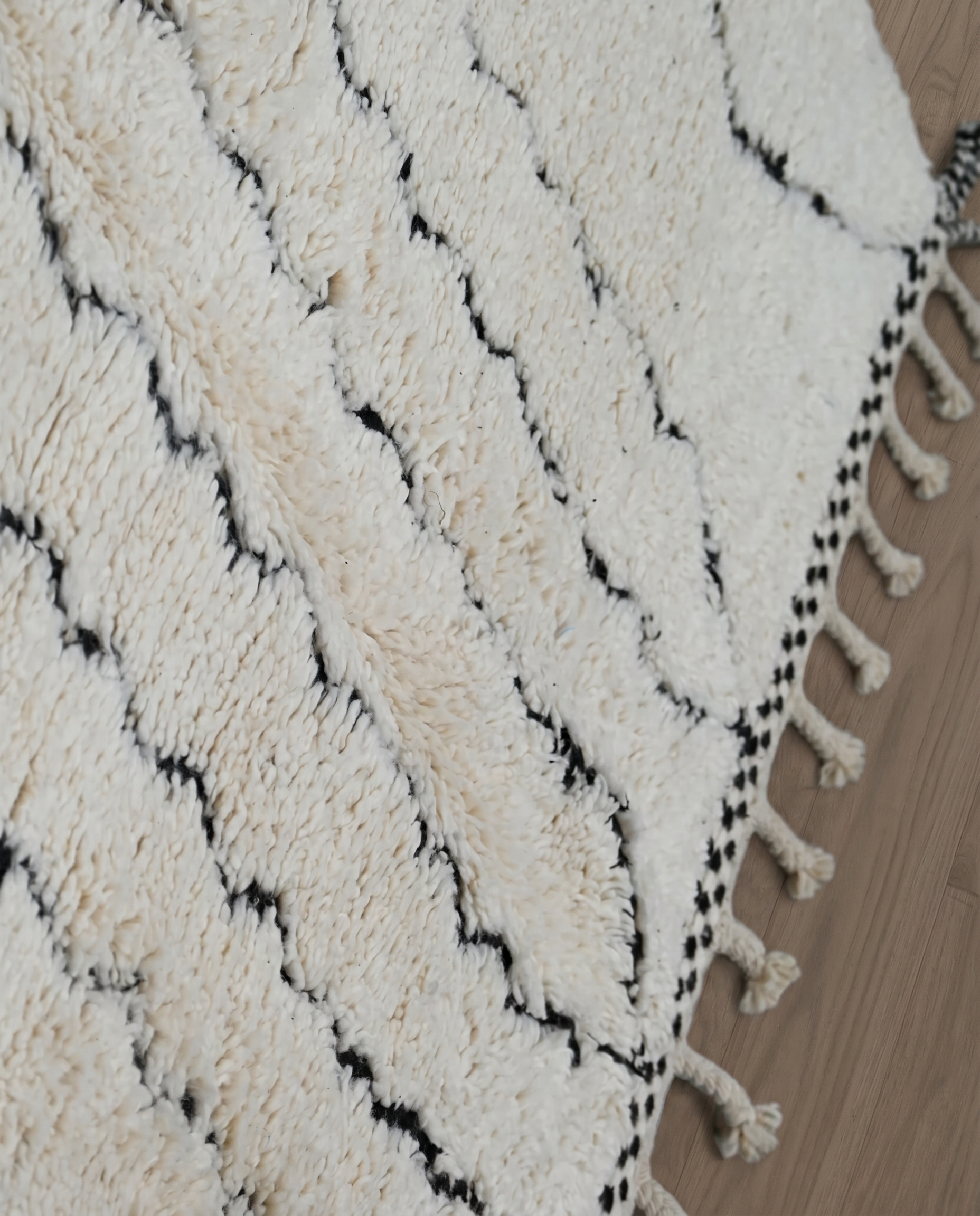 SALMA Beni Ourain cream diamond lattice Moroccan rug close-up showing hand-knotted wool texture and pile detail 2, by NURA