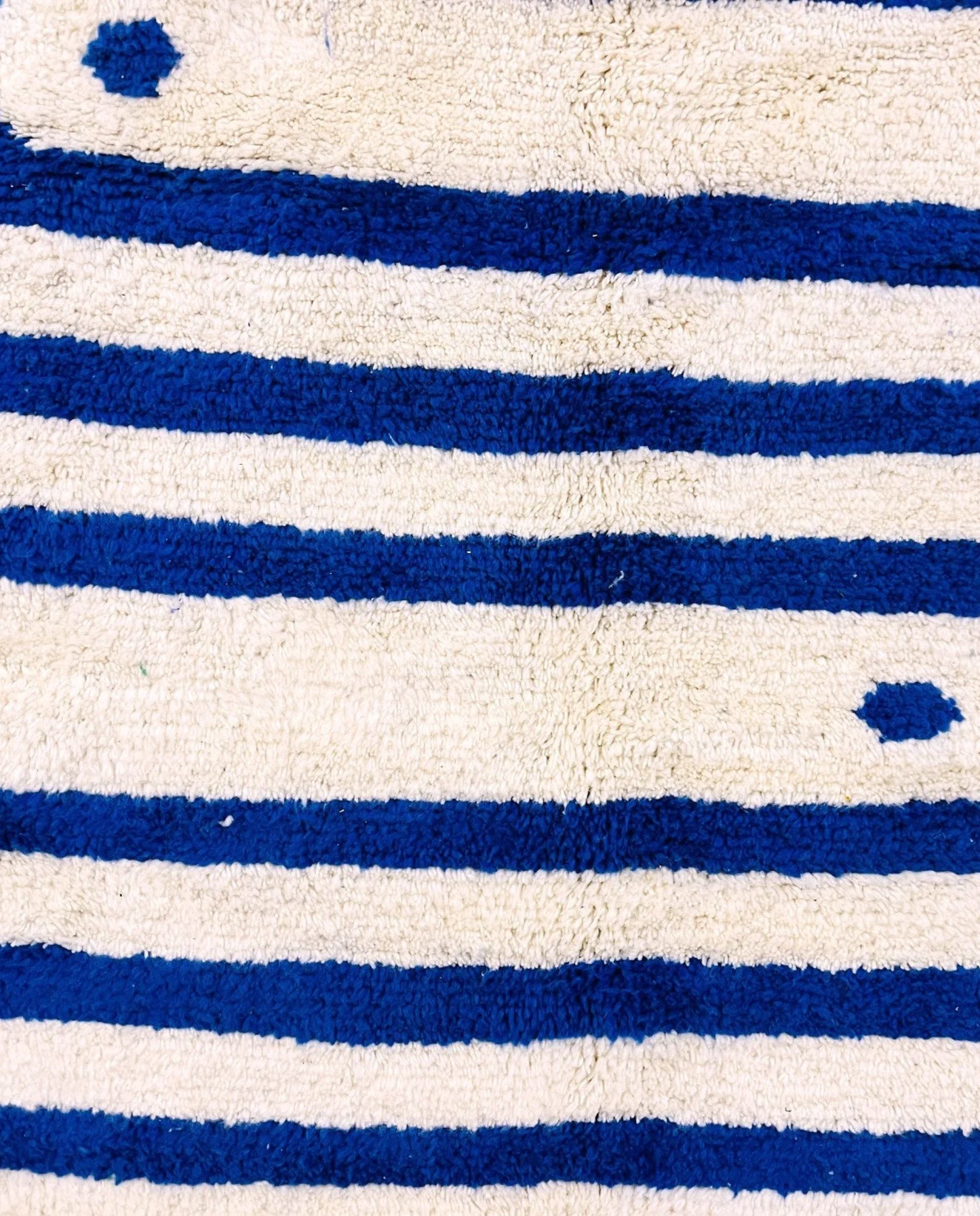 SAMIA Beni Ourain navy graphic arrow bands Moroccan rug close-up showing hand-knotted wool texture and pile detail 1, by NURA