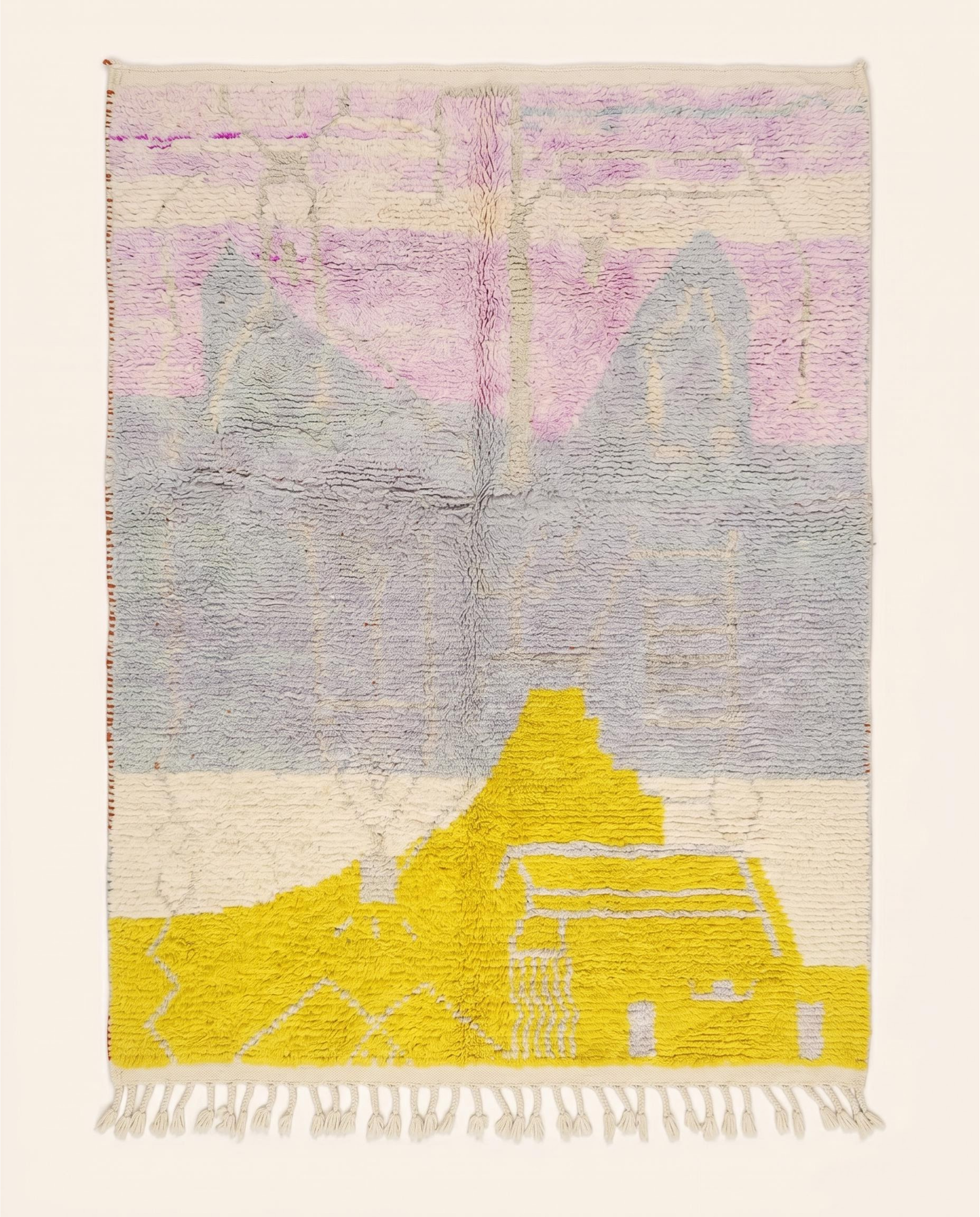 A contemporary Azilal Moroccan rug by NURA with large abstract color blocks in yellow, pink, and cream on a grey wool pile.