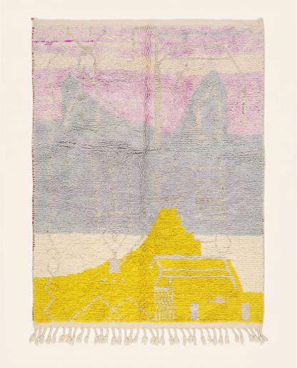 A contemporary Azilal Moroccan rug by NURA with large abstract color blocks in yellow, pink, and cream on a grey wool pile.