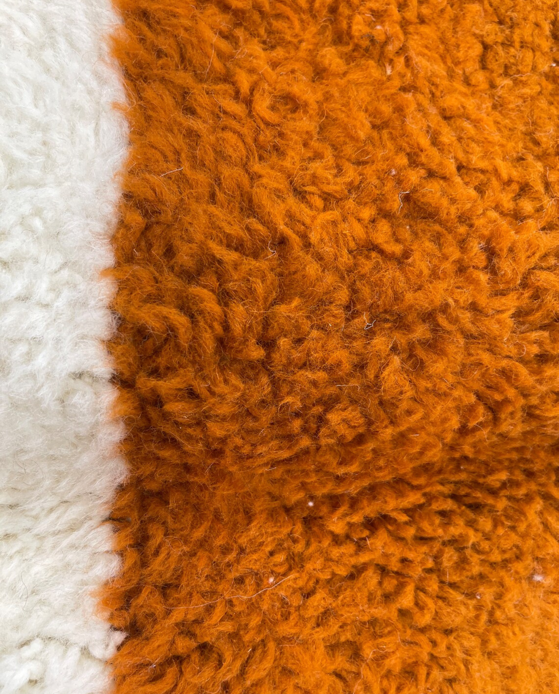 SARA Beni Ourain cream bold hourglass Moroccan rug close-up showing hand-knotted wool texture and pile detail 2, by NURA