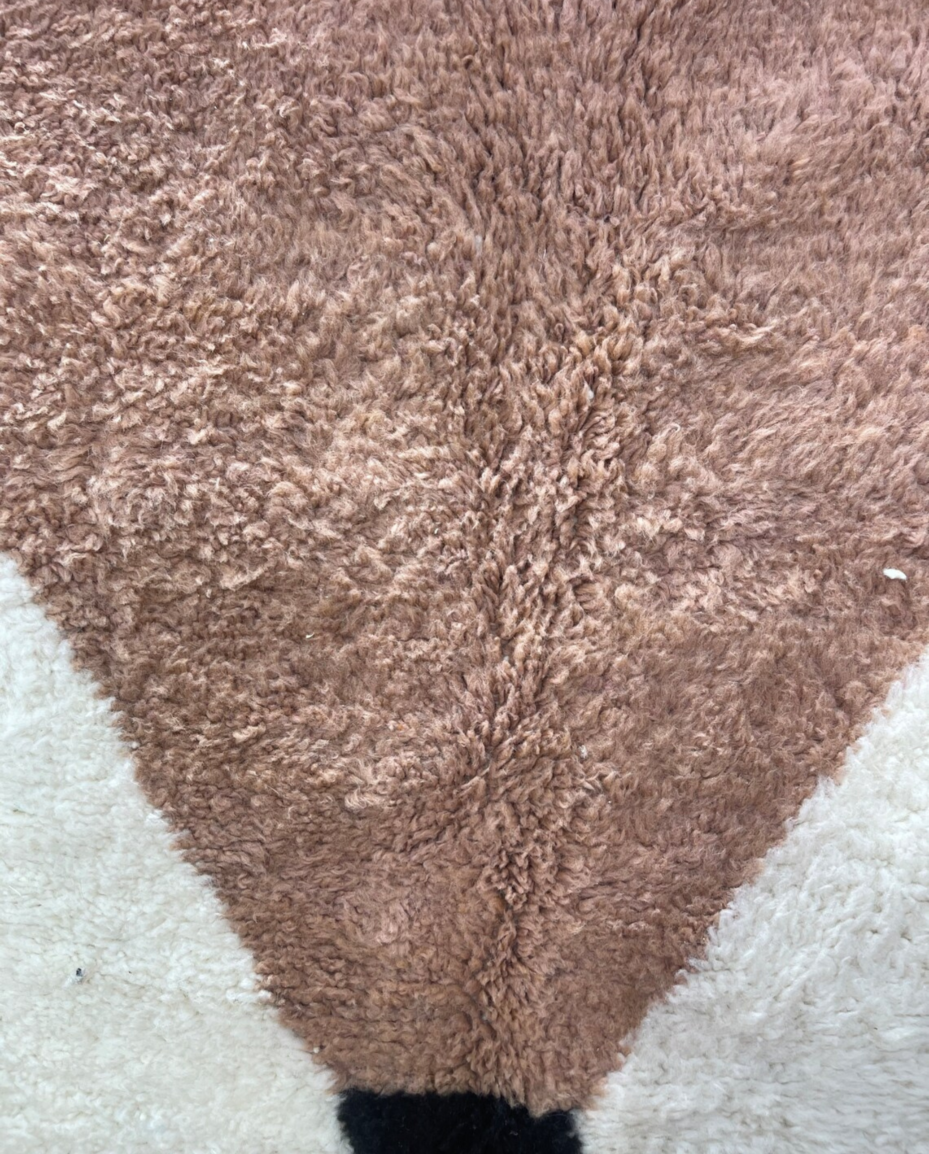 SARA Beni Ourain cream bold hourglass Moroccan rug close-up showing hand-knotted wool texture and pile detail, by NURA