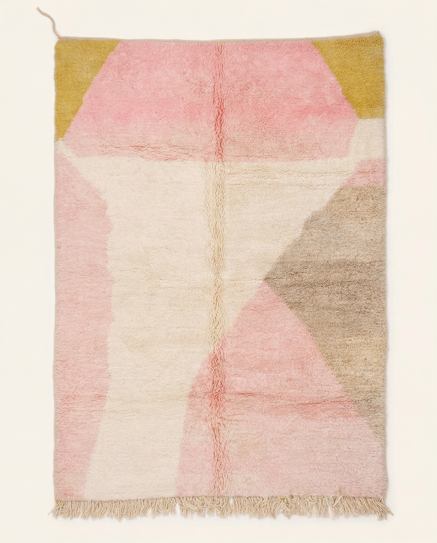 Plush ivory Azilal Moroccan rug with bold abstract color blocks in pink, mustard, and taupe, featuring a thick high pile, by NURA.