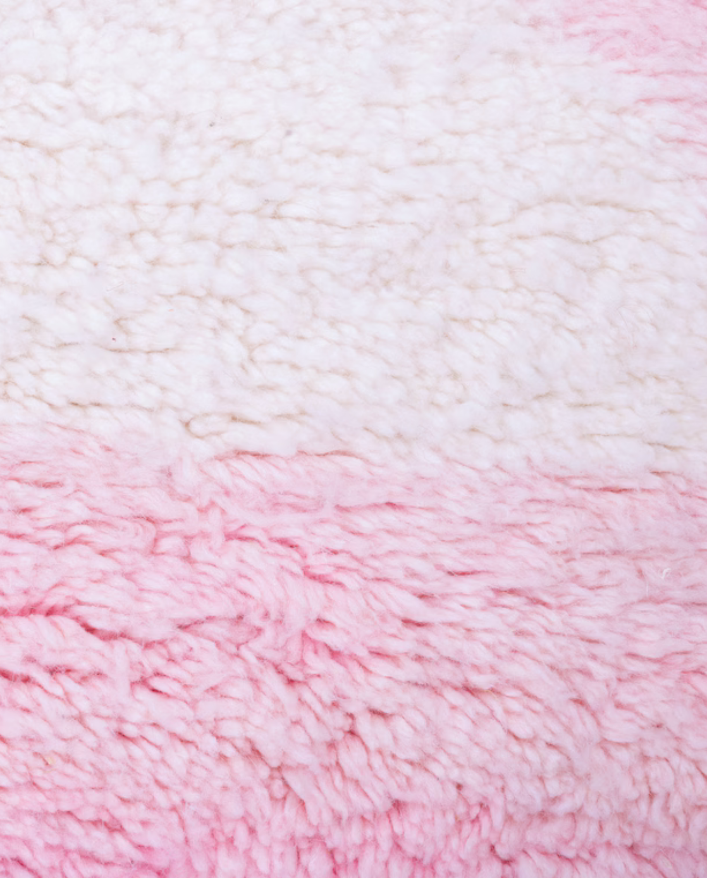 SILYA Azilal pink abstract color block Moroccan rug close-up showing hand-knotted wool texture and pile detail, by NURA